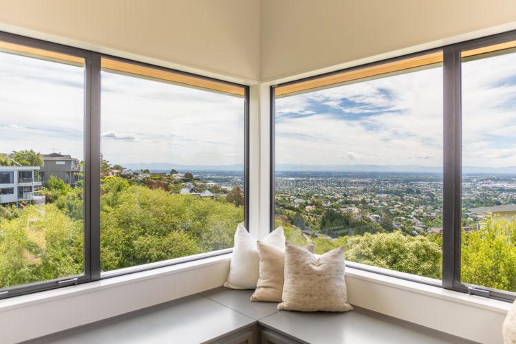 Architectural 2 storey passive SuperHome view of Christchurch from reading nook built on steep hill slope Cashmere