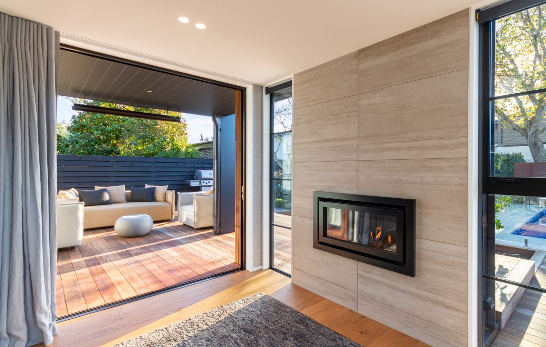 St Albans architecturally designed two storey home lounge gas fire with level outdoor access