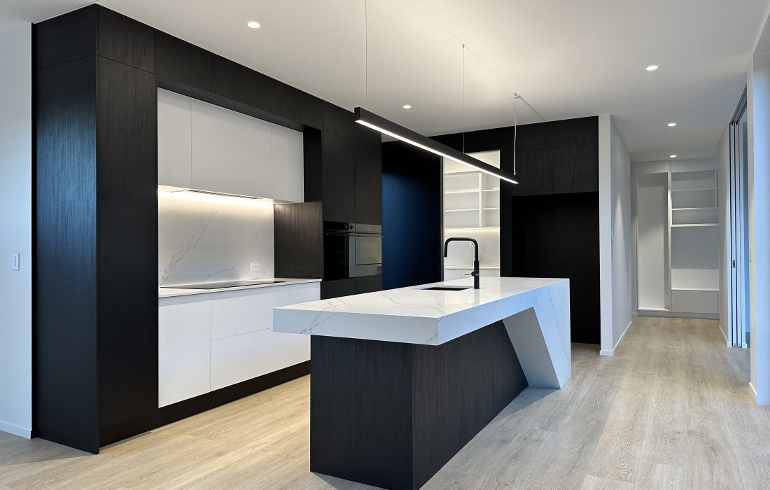 Architecturally designed large modern home black and white kitchen Casebrook