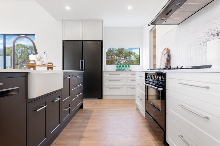 Architecturally designed rural home two tone kitchen joinery with butlers sink Cust