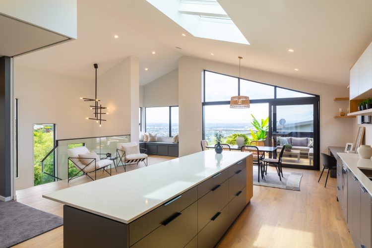 Architectural 2 storey passive SuperHome kitchen dining skylights built on steep hill slope Cashmere